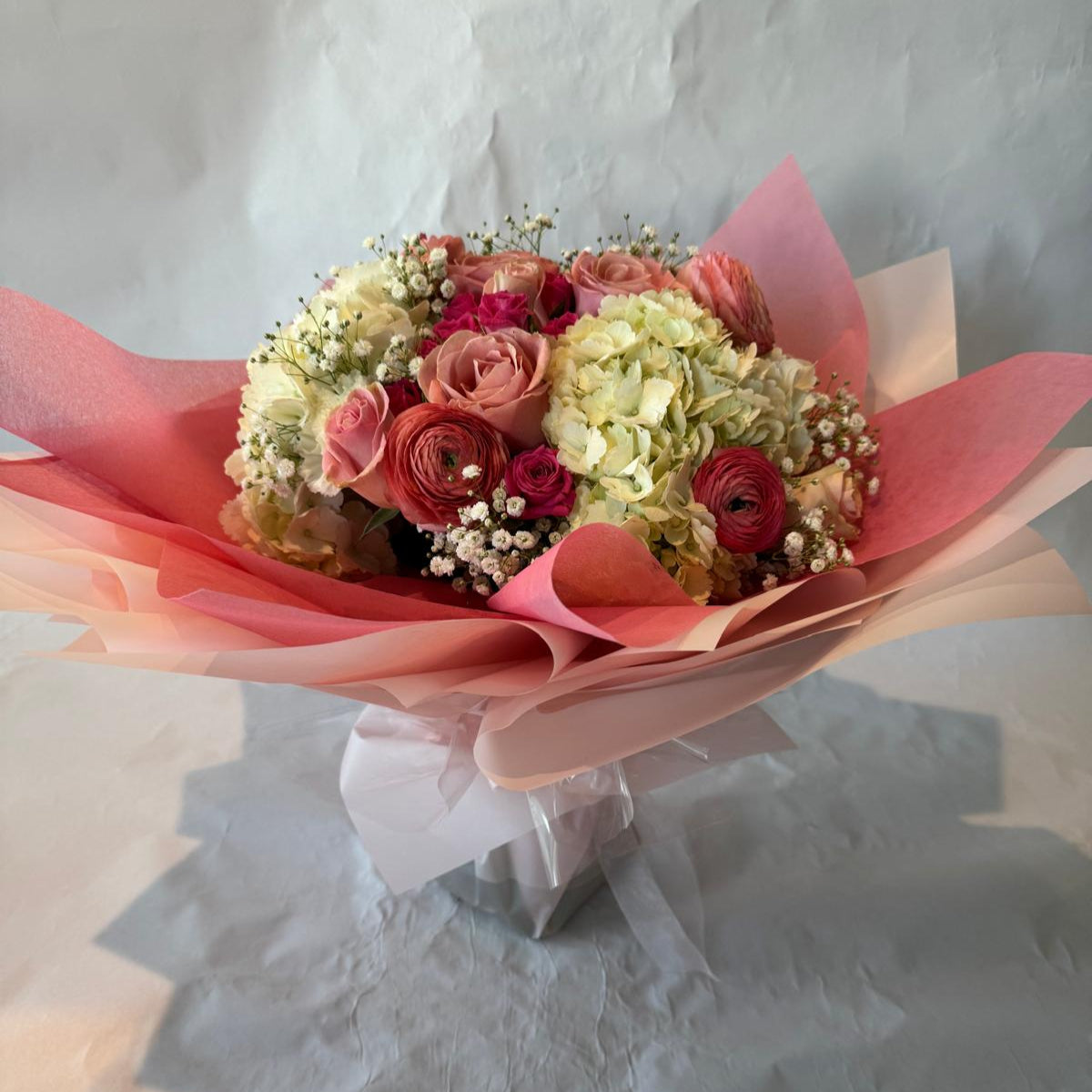 Blush pink and ivory baby shower bouquet with a sweet and delicate look, perfect for celebrating a baby girl.