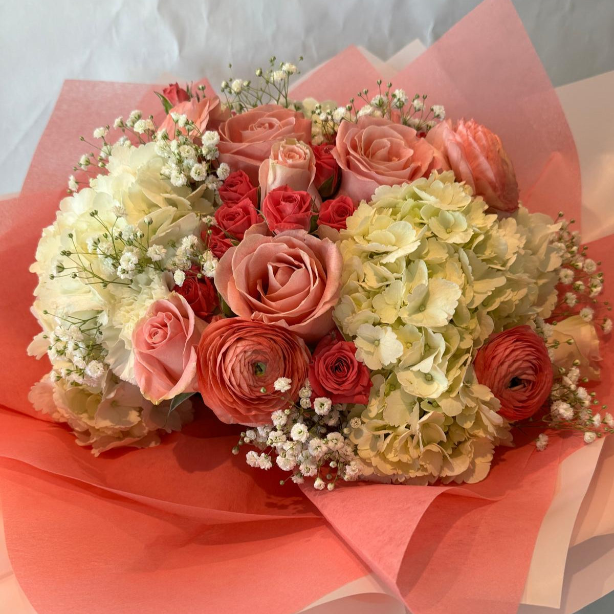 Blush pink and ivory baby shower bouquet with a sweet and delicate look, perfect for celebrating a baby girl.