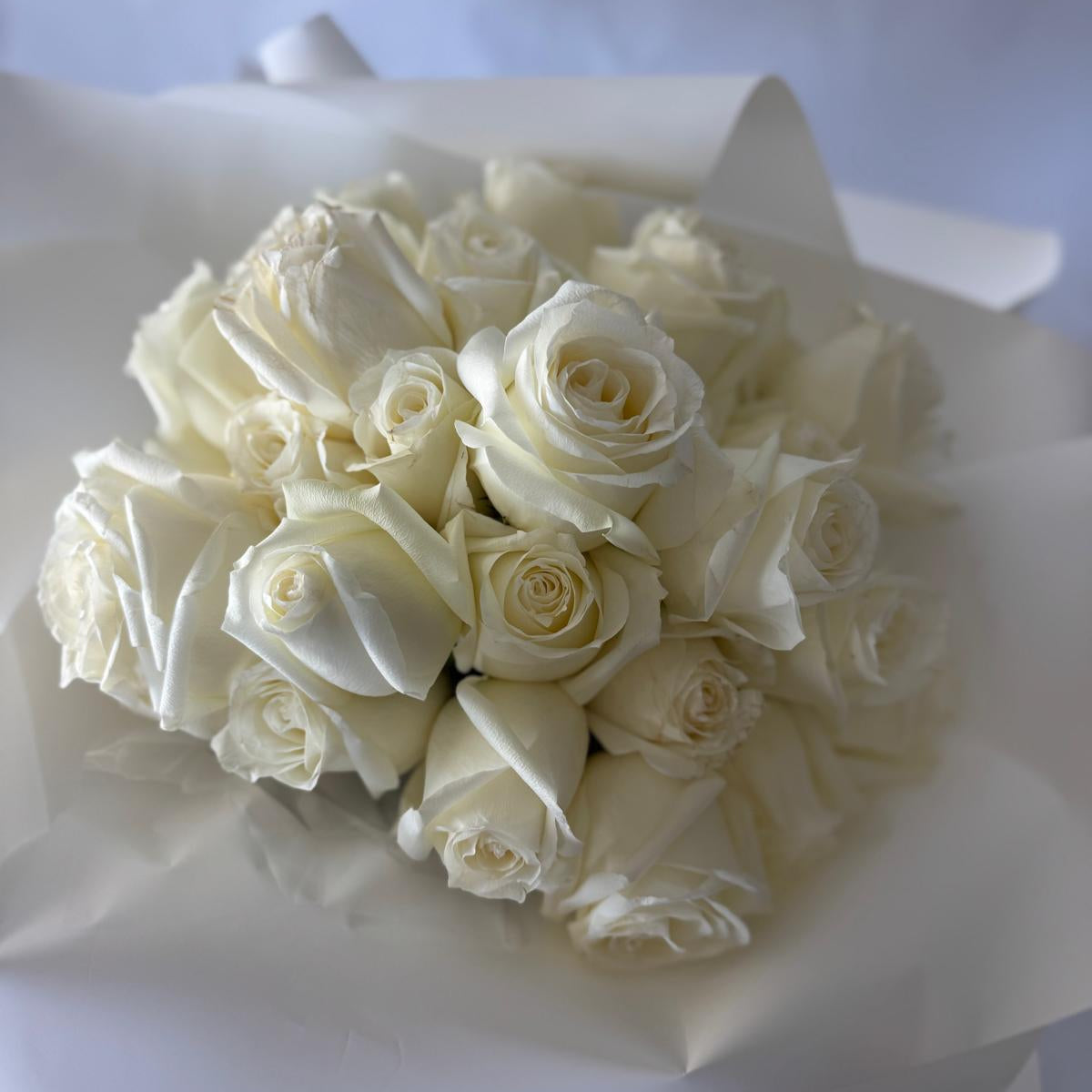 A bouquet of white roses in your chosen size.