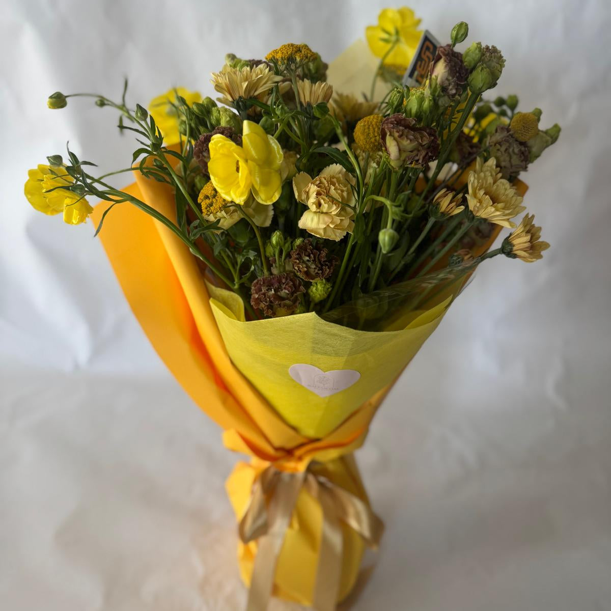 Signature floral bouquet inspired by the Padres, featuring rich brown, gold, and cream blooms. Wrapped in Korean paper with a silk ribbon and matching team sticker.