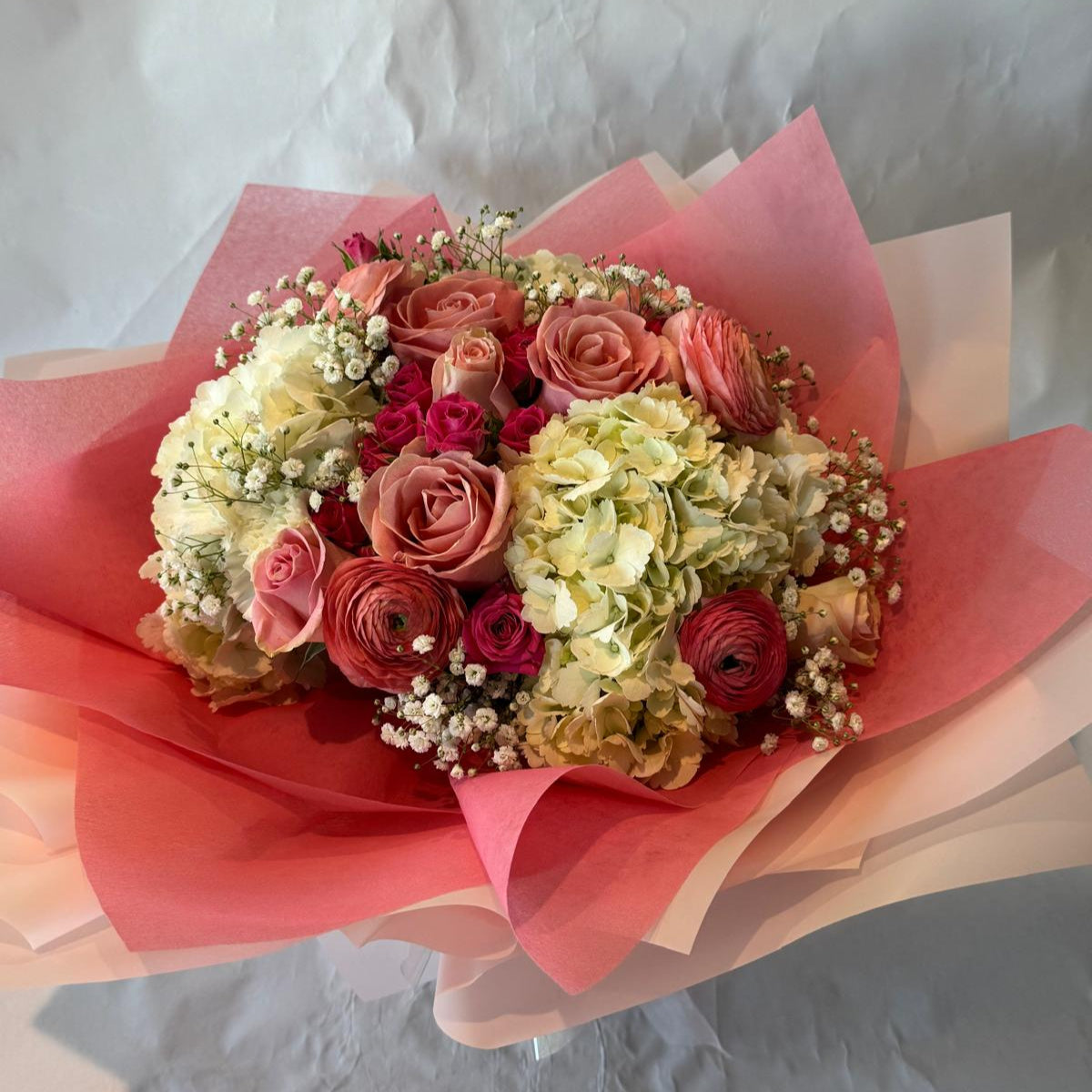 Blush pink and ivory baby shower bouquet with a sweet and delicate look, perfect for celebrating a baby girl.