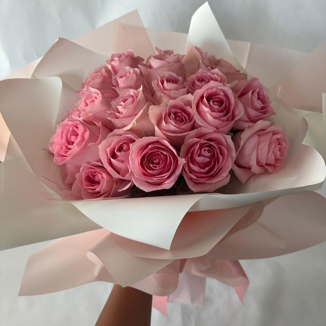 A bouquet of pink roses in your chosen size.