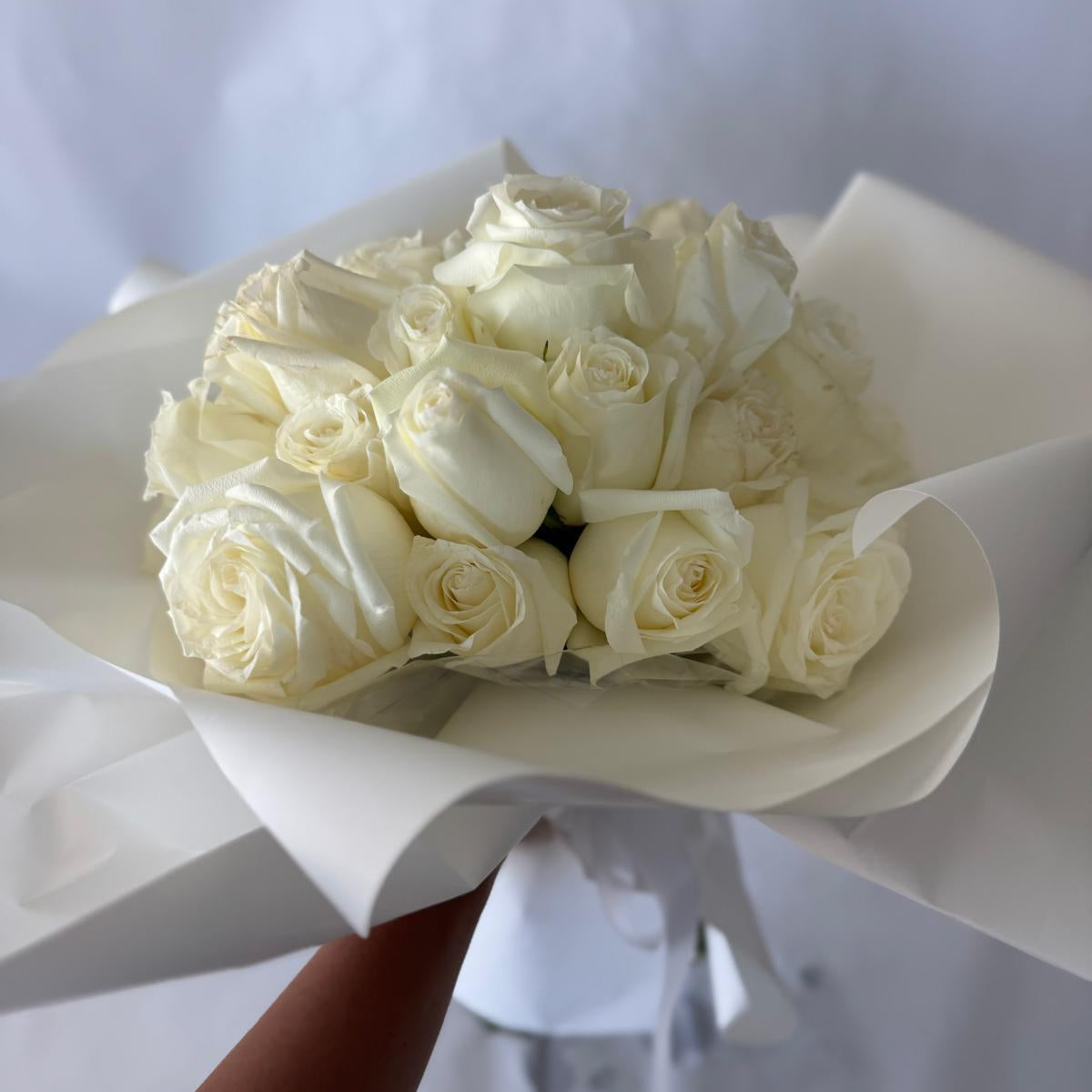 A bouquet of white roses in your chosen size.