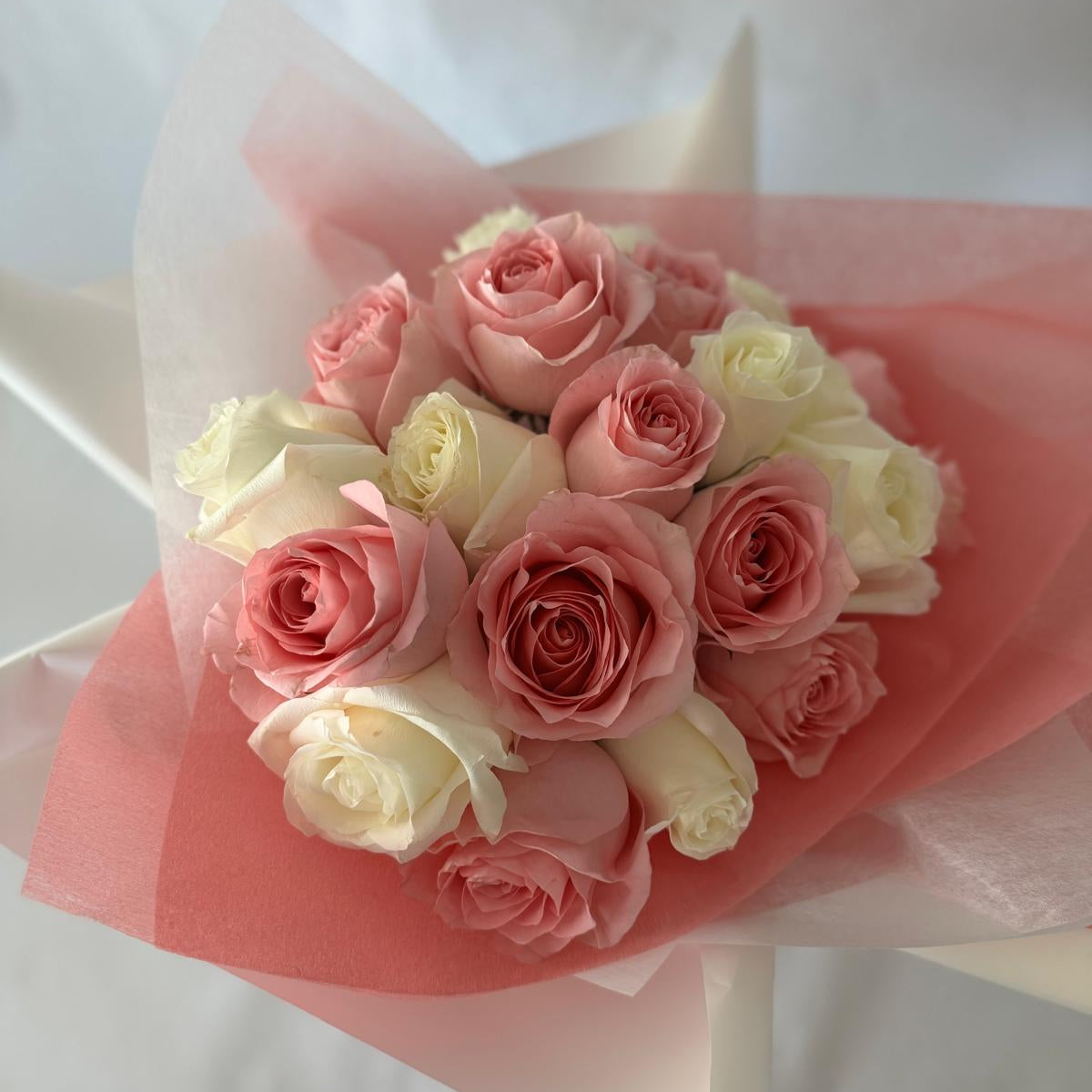 A bouquet of mixed pink and white roses in your chosen size.