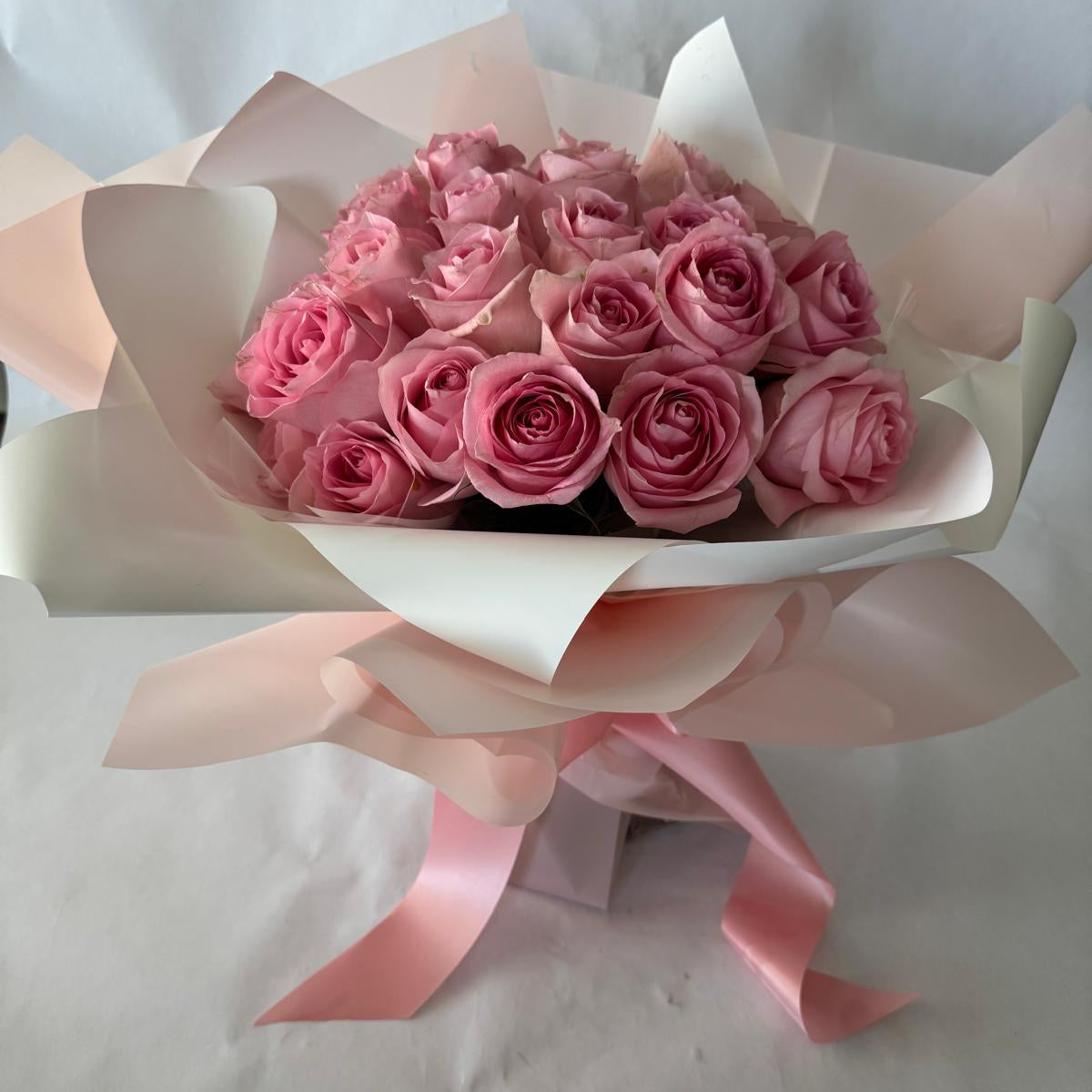 A bouquet of pink roses in your chosen size.