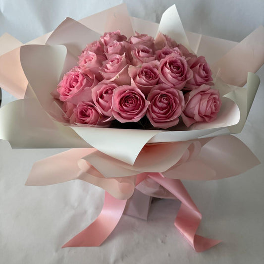 A bouquet of pink roses in your chosen size.