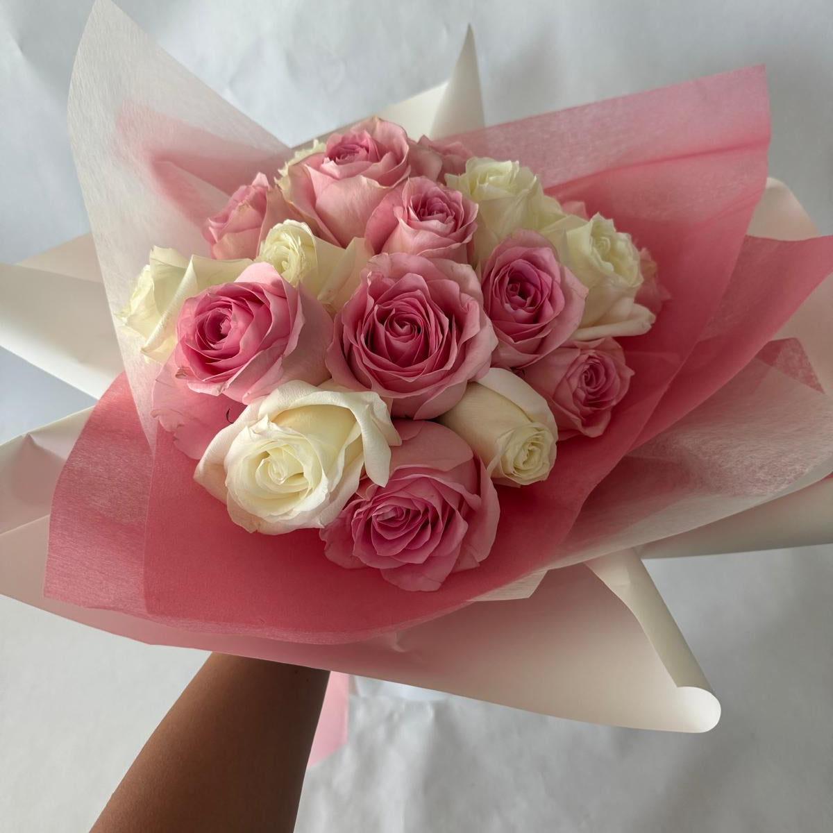 A bouquet of mixed pink and white roses in your chosen size.