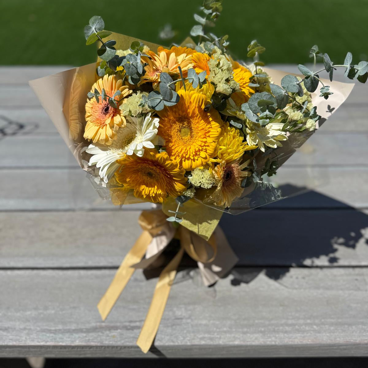 Cheerful yellow bouquet handcrafted with lush, sunshine-toned blooms