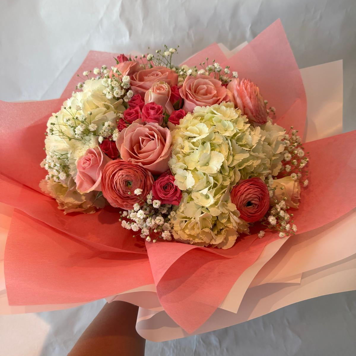 Blush pink and ivory baby shower bouquet with a sweet and delicate look, perfect for celebrating a baby girl.