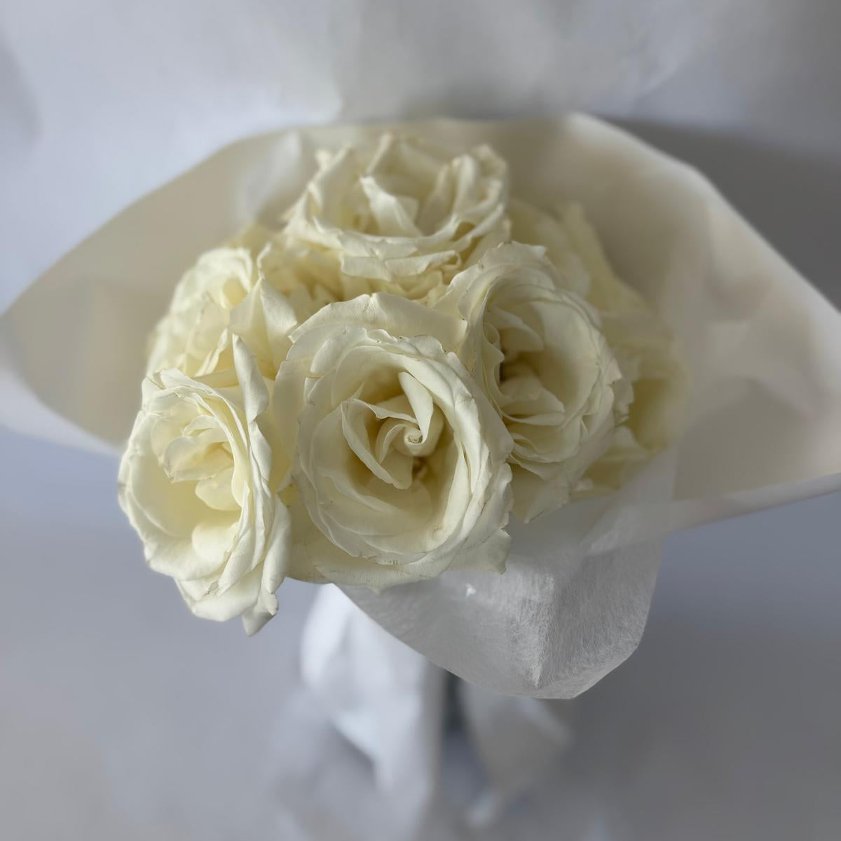 A bouquet of white roses in your chosen size.