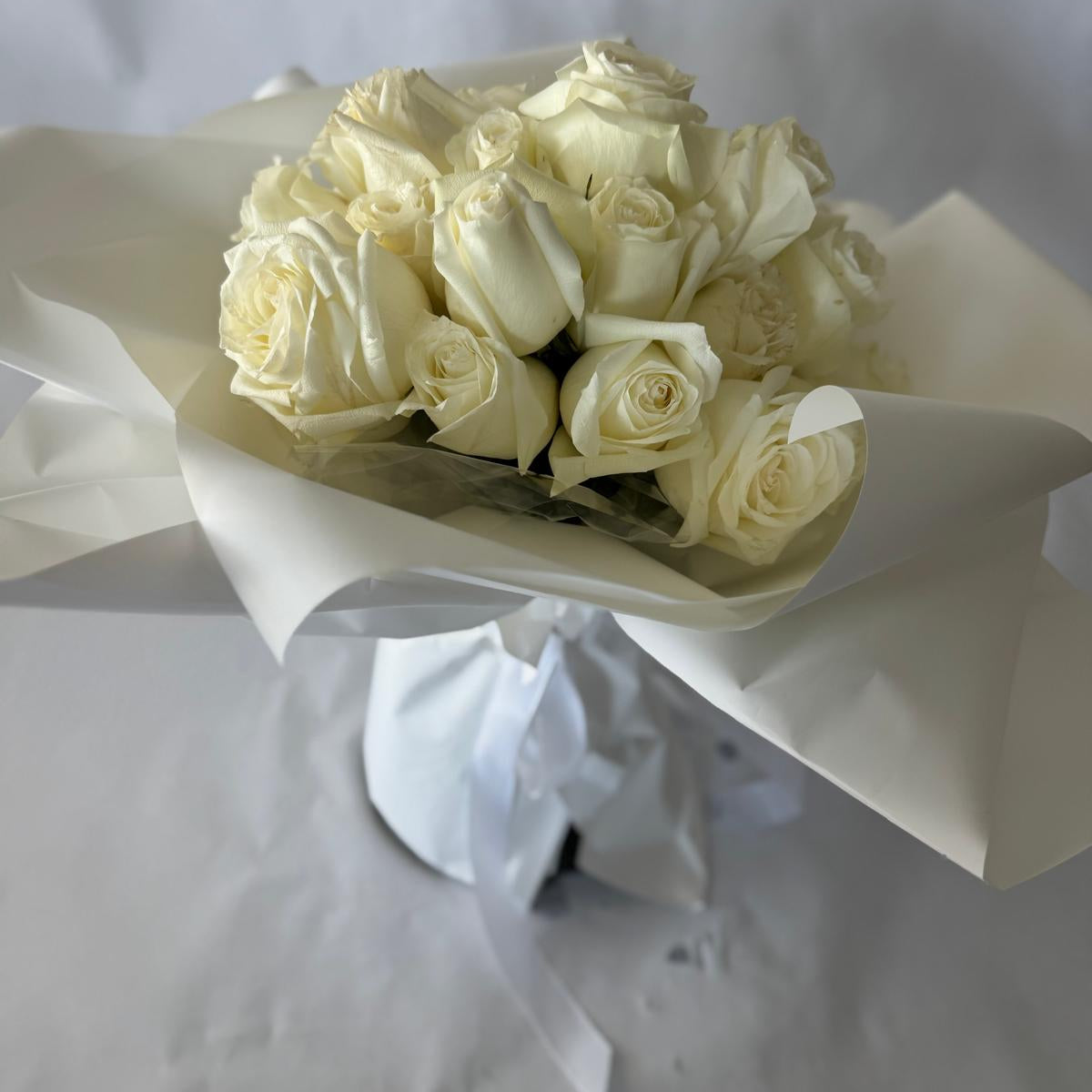 A bouquet of white roses in your chosen size.