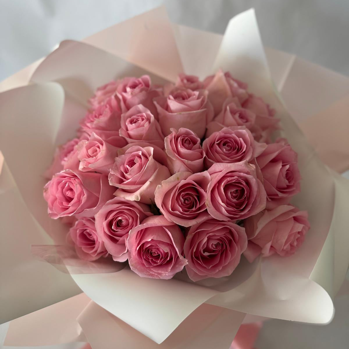 A bouquet of pink roses in your chosen size.